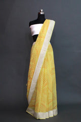 Lemon yellow khaddi georgette water zari saree with orange texture