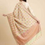 Premium Khaddi Georgette Silk Pure Banarasi Dupatta in light yellow with multicolour floral motif work and woven border