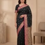 Premium semi Kataan silk Banarasi saree in black colour with floral zari border and pallu and delicate booti work
