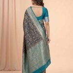 Premium Chiniya Silk Banarasi saree in black and sea green contrast with intricate floral jaal zari work and detailed pallu
