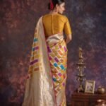 Premium handwoven Kataan Silk Banarasi Rangkart saree in mustard with colourful block work, zari border and detailed pallu