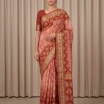 Premium cotton Bandhej Banarasi saree in peach colour with beautiful Bandhani work, multicolour motifs and zari border