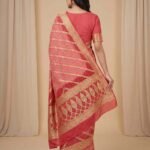 Premium cotton Bandhej Banarasi saree in peach colour with beautiful Bandhani work, multicolour motifs and intricate zari border and pallu