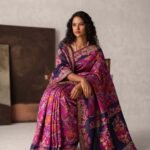 Premium handwoven Kataan Tissue Silk Banarasi saree in pink with colourful floral Meenakari work and detailed border and pallu