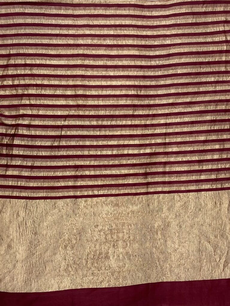 Premium Munga Silk Banarasi saree in maroon and gold with elegant zari stripe work and rich traditional border and pallu