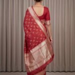 Premium handwoven Kataan Silk Banarasi saree in red with bird motif work, geometric pattern, zari border and detailed pallu .