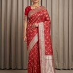 Premium handwoven Kataan Silk Banarasi saree in red with bird motif work, geometric pattern, zari border and detailed pallu .