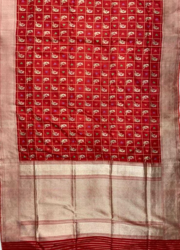 Premium handwoven Kataan Silk Banarasi saree in red with bird motif work, geometric pattern, zari border and detailed pallu .