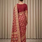 Premium cotton Bandhej Banarasi saree in red colour with Bandhani work, multicolour floral motifs and zari border