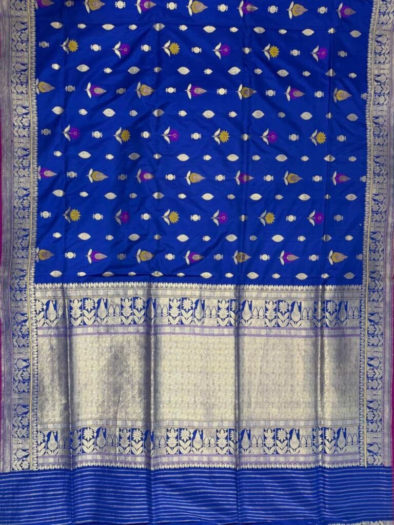 Premium handwoven Kataan Silk Banarasi saree in royal blue with colourful floral Meenakari work, intricate zari border and detailed pallu