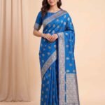Premium Chiniya Silk Banarasi saree in teal blue with beautiful floral zari and colourful Meenakari work