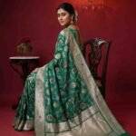 Premium handwoven Kataan Silk Banarasi saree in sea green with colourful floral Meenakari Jaal work and detailed zari border and pallu