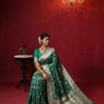 Premium handwoven Kataan Silk Banarasi saree in sea green with colourful floral Meenakari Jaal work and detailed zari border and pallu
