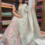 Shop Premium Customised Olive Green Banarasi Tissue Silk Lehenga with sequin, patchwork, Resham embroidery and Tikri work, paired with a matching tissue silk dupatta. Perfect for weddings and mehendi.