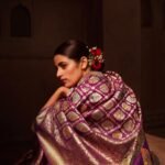 Premium handwoven Kataan Silk Banarasi saree in purple wine colour with floral Meenakari brocade work and detailed zari border and pallu