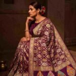 Premium handwoven Kataan Silk Banarasi saree in purple wine colour with floral Meenakari brocade work and detailed zari border and pallu