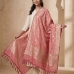 Baby pink Semi Kataan Silk Banarasi dupatta with golden zari floral jaal work, an intricate traditional border and decorative pink tassels.