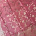Baby pink Semi Kataan Silk Banarasi dupatta with golden zari floral jaal work, an intricate traditional border and decorative pink tassels.
