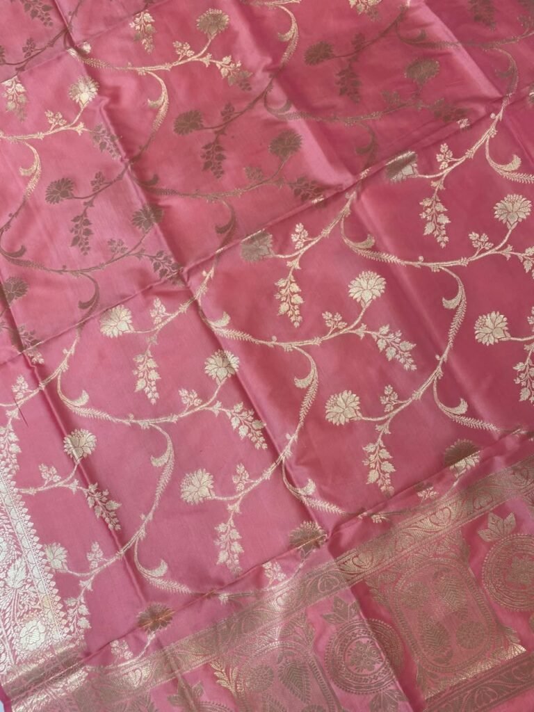 Baby pink Semi Kataan Silk Banarasi dupatta with golden zari floral jaal work, an intricate traditional border and decorative pink tassels.