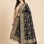 Premium black Semi Kataan Silk Banarasi dupatta featuring golden zari floral jaal motifs, an ornate woven border and decorative tassels.