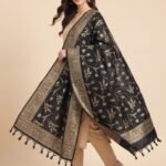 Premium black Semi Kataan Silk Banarasi dupatta featuring golden zari floral jaal motifs, an ornate woven border and decorative tassels.