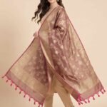 Premium chiku Semi Kataan Silk Banarasi dupatta with golden zari floral jaal work, an ornate woven border and contrasting pink tassels.