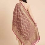 Premium chiku Semi Kataan Silk Banarasi dupatta with golden zari floral jaal work, an ornate woven border and contrasting pink tassels.