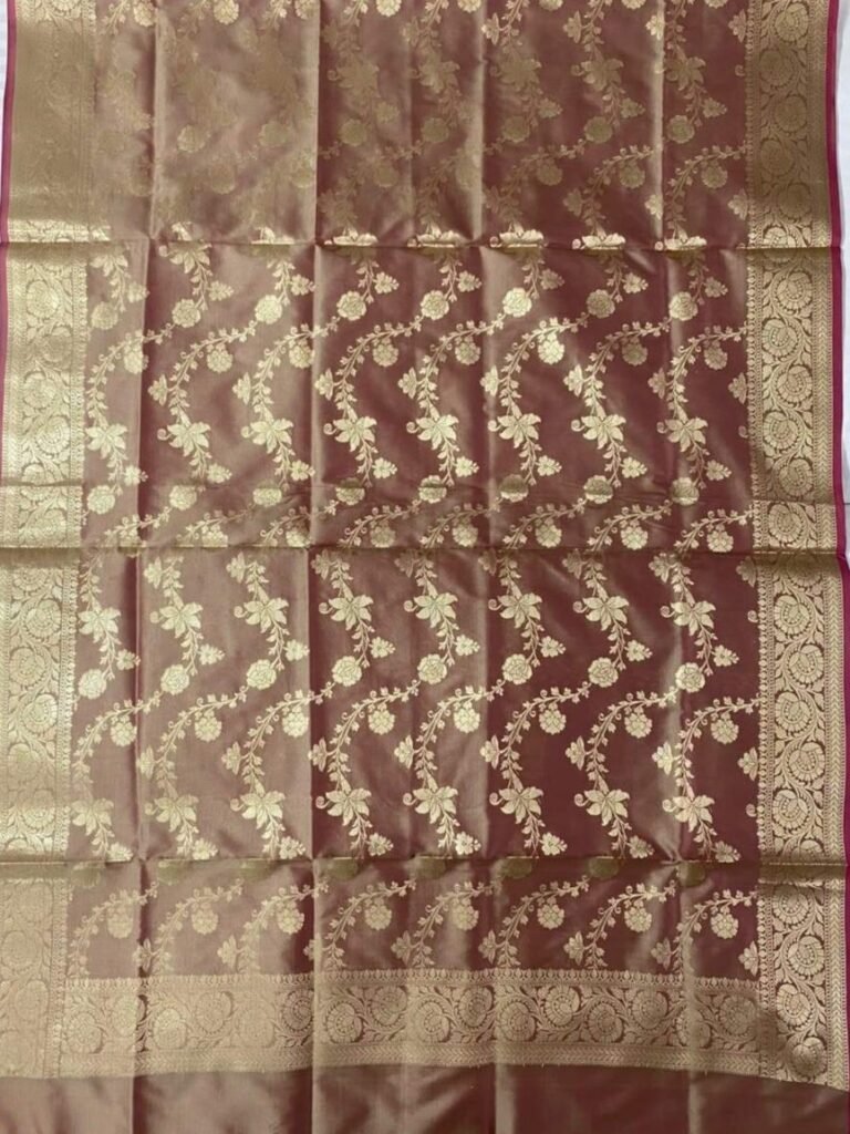 Premium chiku Semi Kataan Silk Banarasi dupatta with golden zari floral jaal work, an ornate woven border and contrasting pink tassels.