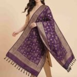 Premium deep purple Semi Kataan Silk Banarasi dupatta with golden zari floral jaal motifs, an intricate woven border and decorative tassels.