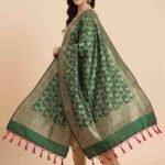 Premium green Semi Kataan Silk Banarasi dupatta featuring golden zari floral jaal work, an ornate woven border and pink tassels.