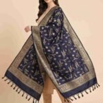 Premium navy blue Semi Kataan Silk Banarasi dupatta with golden zari floral jaal motifs, an intricate woven border and decorative tassels.