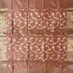 Premium peach Semi Kataan Silk Banarasi dupatta featuring golden zari floral jaal work, an ornate border and decorative pink tassels.