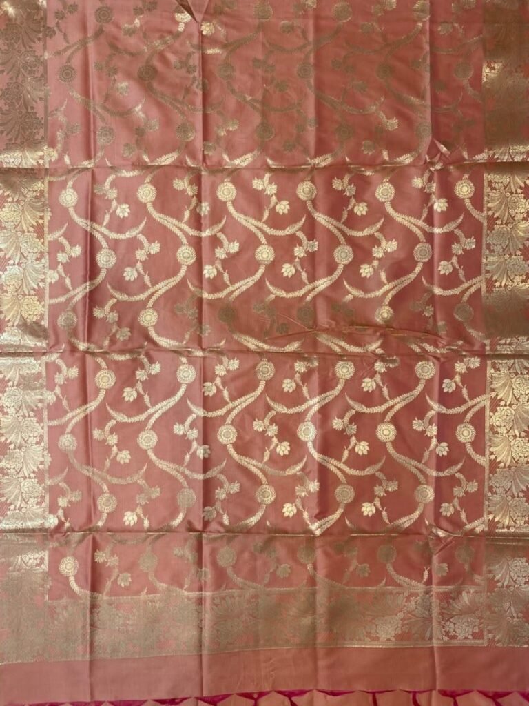 Premium peach Semi Kataan Silk Banarasi dupatta featuring golden zari floral jaal work, an ornate border and decorative pink tassels.