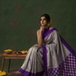 Premium tissue silk pure Banarasi saree in silver grey with zigzag zari pattern, purple Chiniya border and silver zari motifs on pallu
