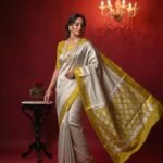 Premium tissue silk pure Banarasi saree with zigzag zari pattern and Chiniya olive gold border and detailed zari pallu