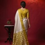 Premium tissue silk pure Banarasi saree with zigzag zari pattern and Chiniya olive gold border and detailed zari pallu