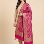 Premium rani pink Semi Kataan Silk Banarasi dupatta with all-over golden zari floral jaal work, an ornate zari border and matching pink tassels.