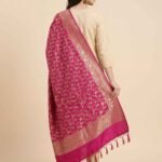 Premium rani pink Semi Kataan Silk Banarasi dupatta with all-over golden zari floral jaal work, an ornate zari border and matching pink tassels.