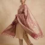 Premium rose pink Semi Kataan Silk Banarasi dupatta featuring golden zari floral jaal work, an ornate zari border and pink tassels.