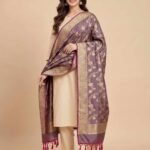 Premium wine Semi Kataan Silk Banarasi dupatta with golden zari floral jaal work, an ornate gold border and magenta-pink tassels.