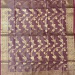 Premium wine Semi Kataan Silk Banarasi dupatta with golden zari floral jaal work, an ornate gold border and magenta-pink tassels.