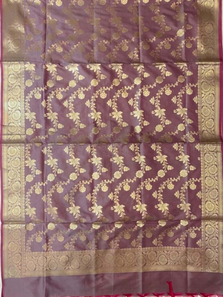 Premium wine Semi Kataan Silk Banarasi dupatta with golden zari floral jaal work, an ornate gold border and magenta-pink tassels.